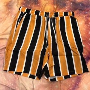 black and yellow striped shorts